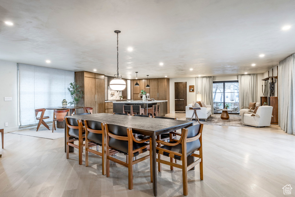 Dining space featuring recessed lighting and light wood-style flooring