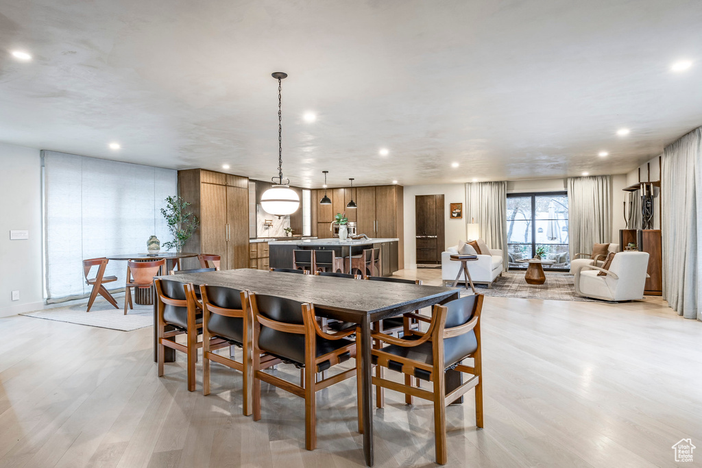 Dining space featuring recessed lighting and light wood-type flooring