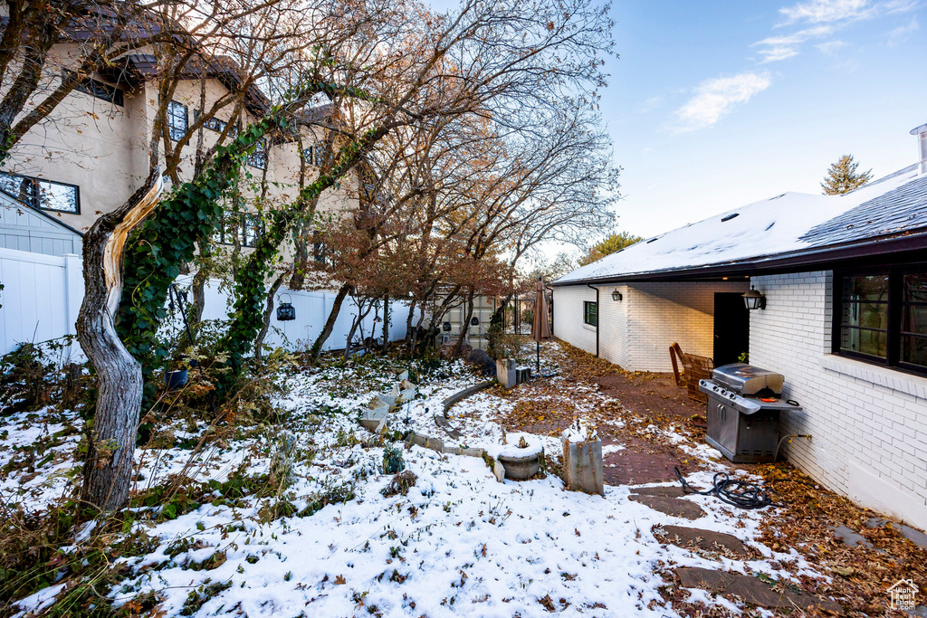 View of yard covered in snow