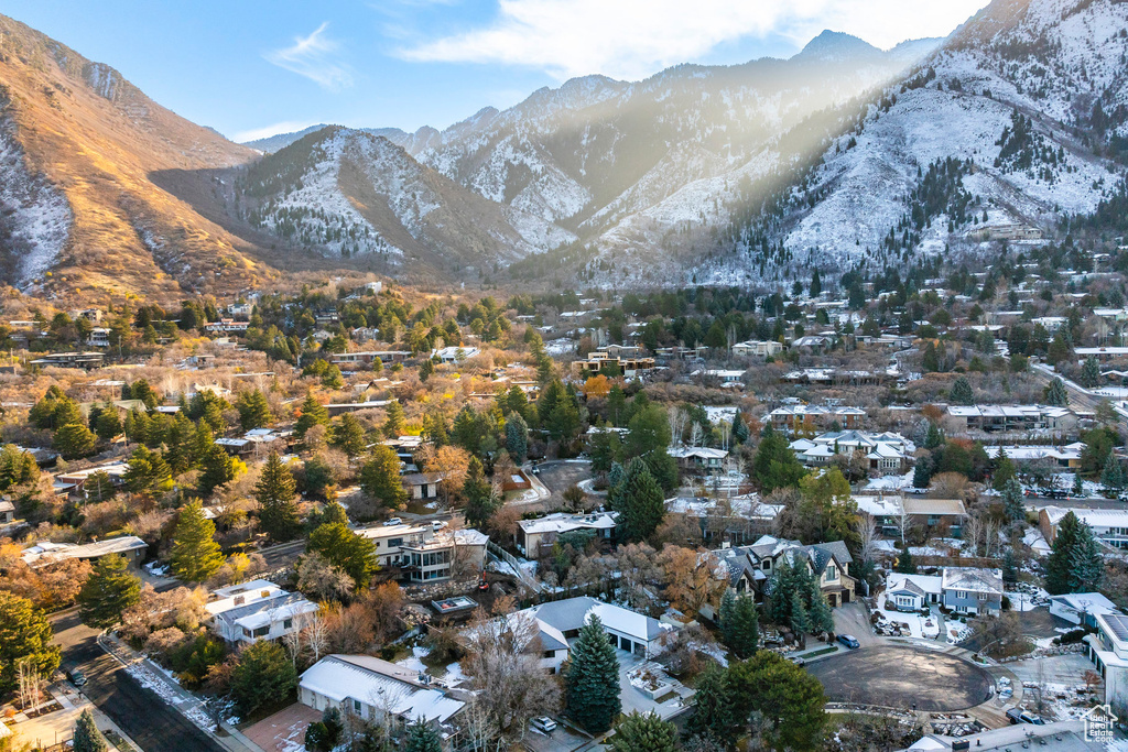 Aerial view of residential area featuring a mountainous background
