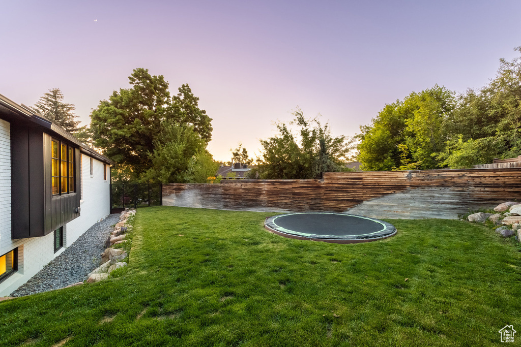 View of yard with a trampoline