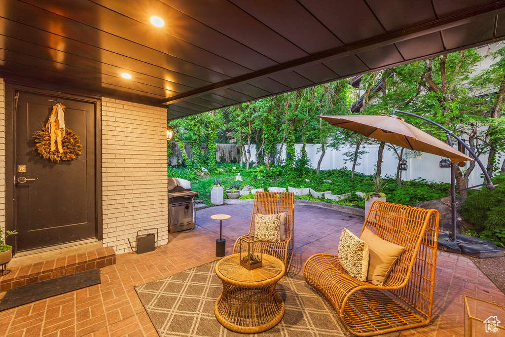 View of patio featuring a grill