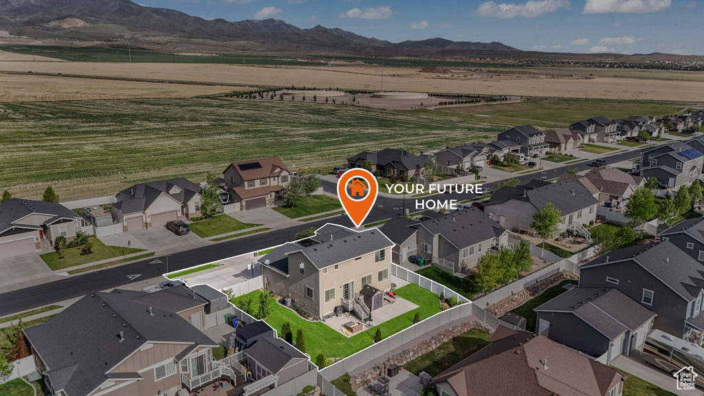 Aerial view of residential area with a mountain backdrop