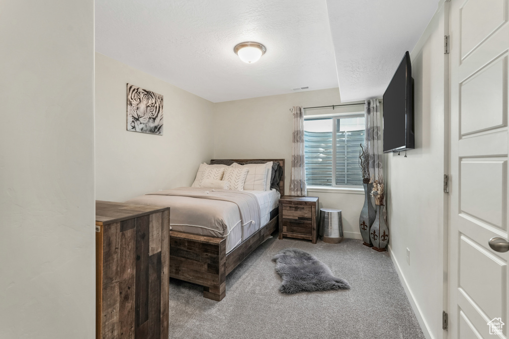 Bedroom with carpet and baseboards