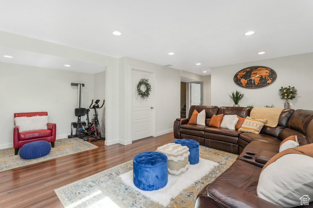 Living room featuring recessed lighting, wood finished floors, and baseboards