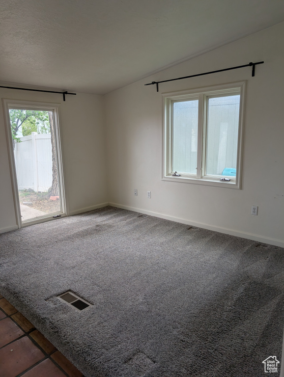 Unfurnished room with baseboards and carpet flooring