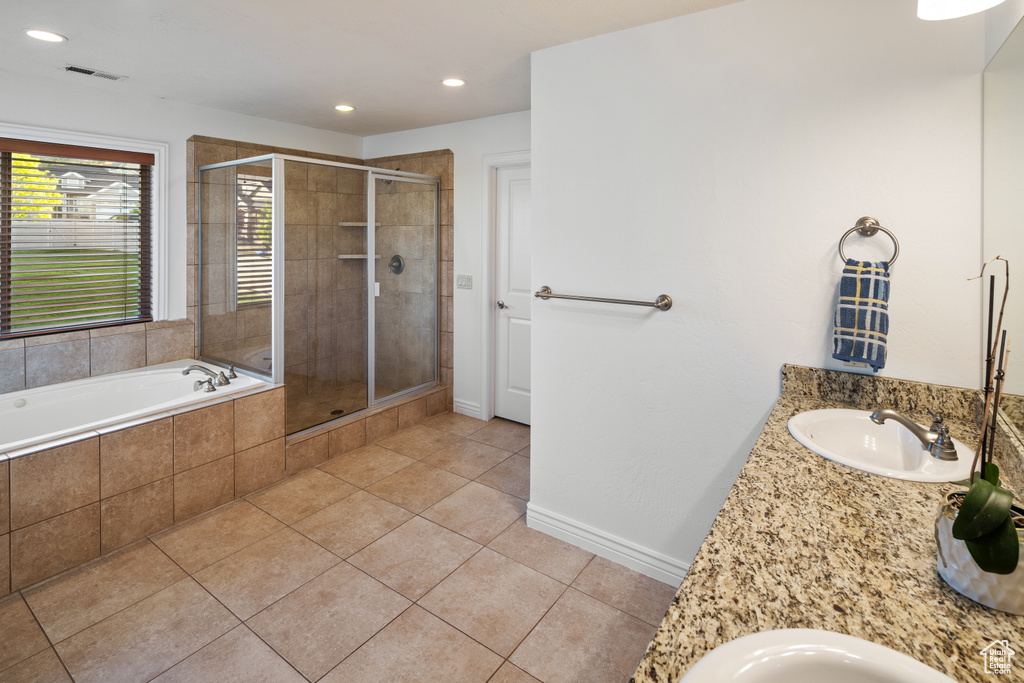 Full bath with tile patterned flooring, a shower stall, a garden tub, recessed lighting, and vanity