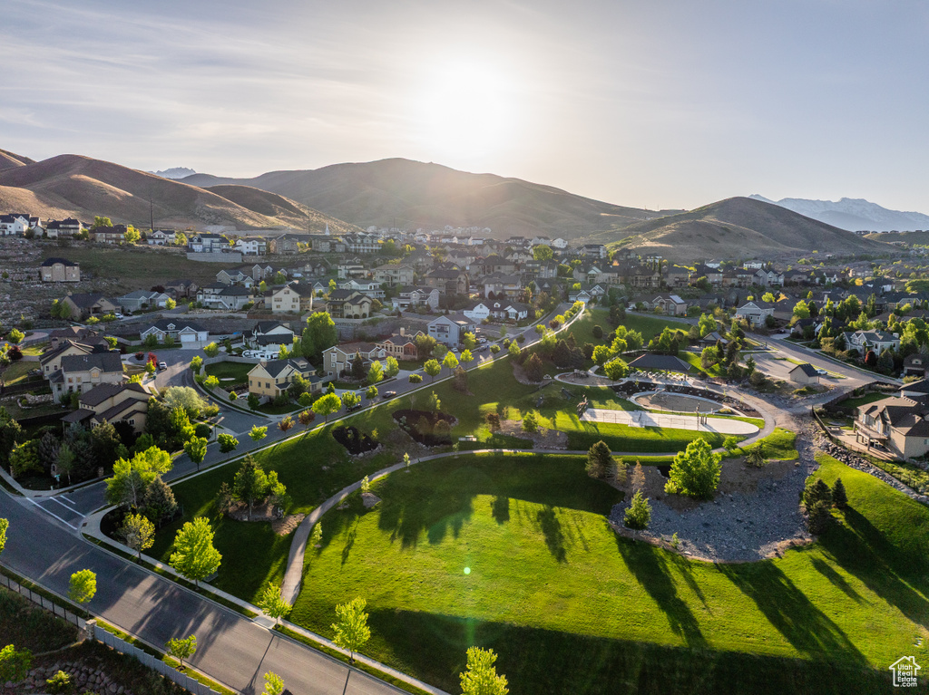 View of property location featuring nearby suburban area and a mountain backdrop