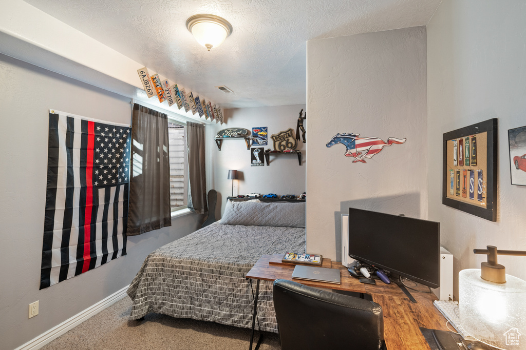 Bedroom with a textured ceiling