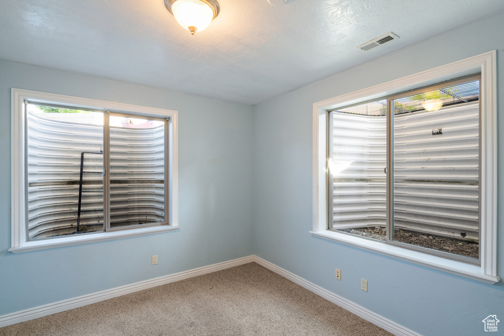 Spare room with carpet flooring and baseboards