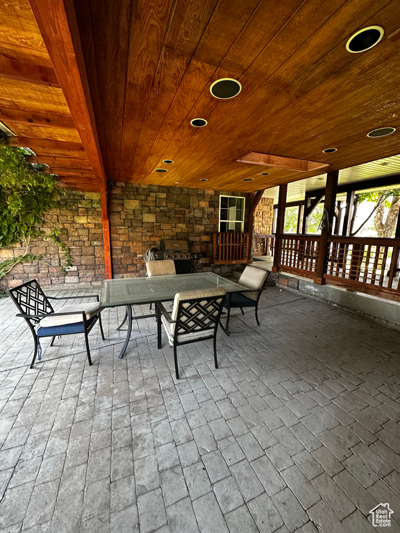 View of patio with outdoor dining area