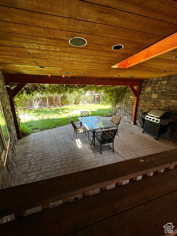 View of patio / terrace with a grill and outdoor dining area