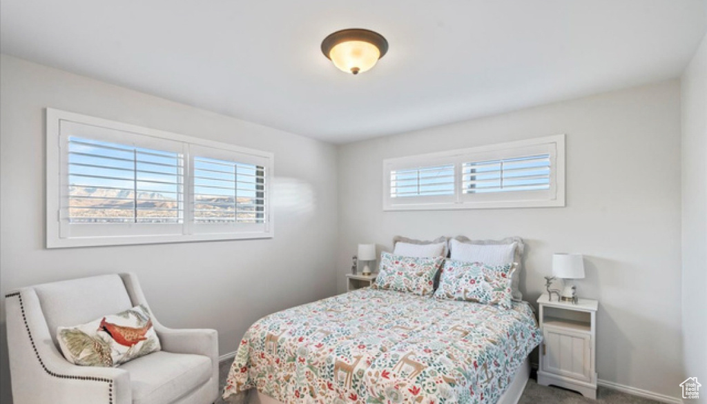 Carpeted bedroom with baseboards