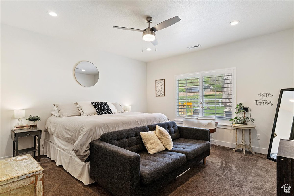 Bedroom with dark carpet, recessed lighting, baseboards, and a ceiling fan