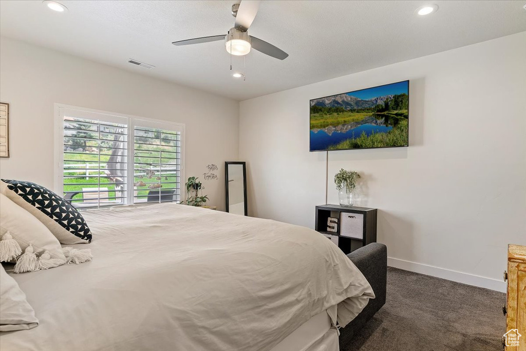 Carpeted bedroom with recessed lighting, baseboards, and a ceiling fan