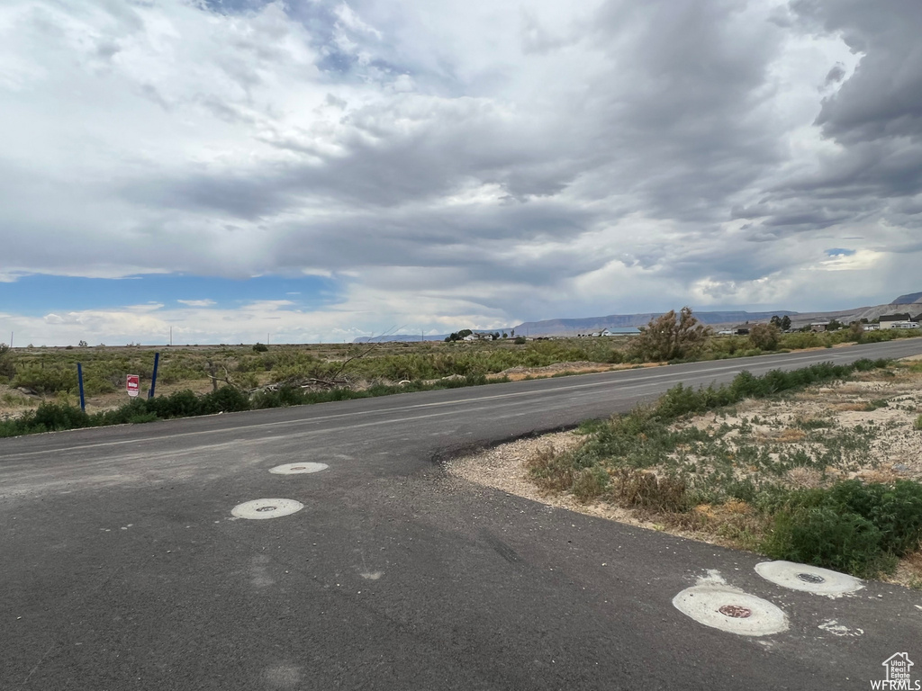 View of asphalt road featuring a mountain view
