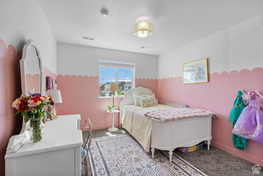 Bedroom featuring carpet flooring and baseboards