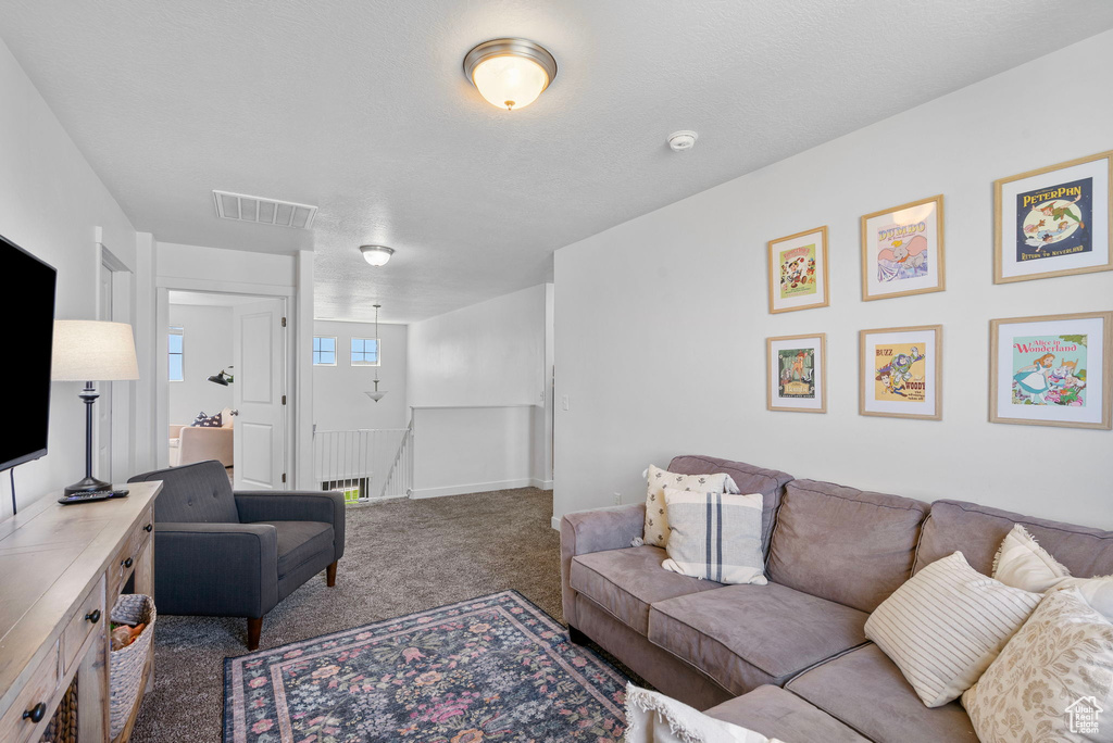 Living room featuring carpet floors and baseboards