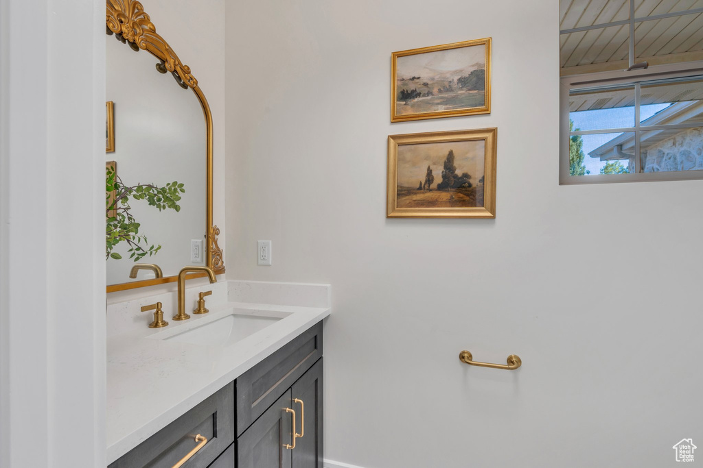 Bathroom with vanity and baseboards