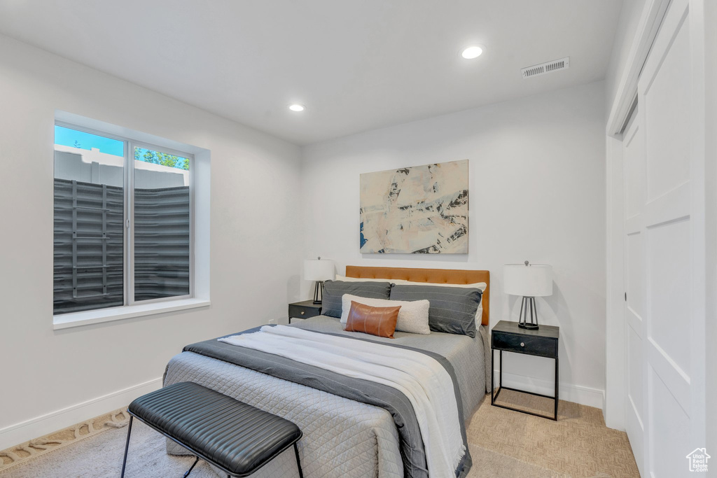 Carpeted bedroom featuring recessed lighting and baseboards
