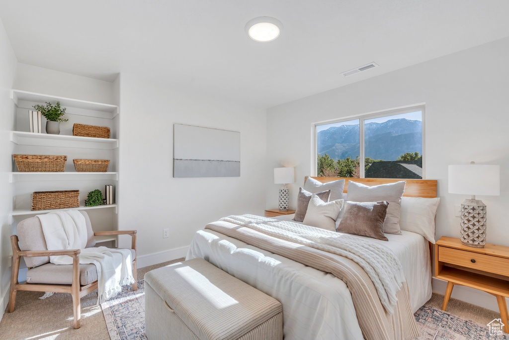 Bedroom featuring baseboards and carpet floors