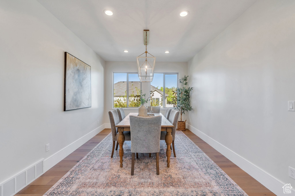 Dining space with recessed lighting, baseboards, and wood finished floors