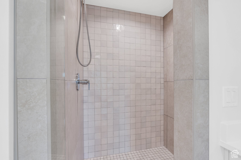 Full bath with a tile shower