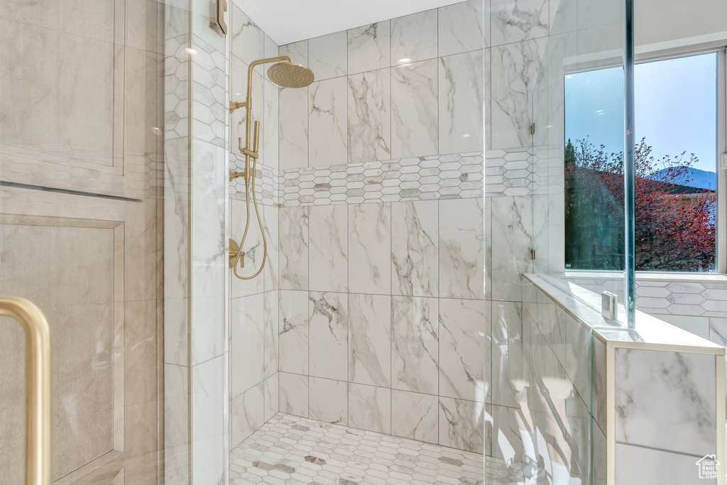 Full bathroom with a shower stall
