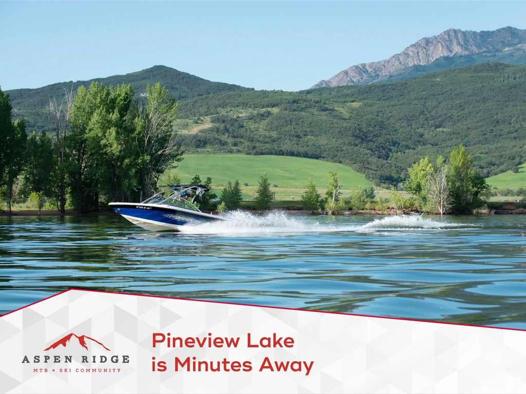 Water view with mountains and a heavily wooded area