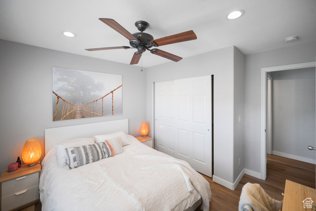 Bedroom featuring wood finished floors, recessed lighting, baseboards, a closet, and ceiling fan