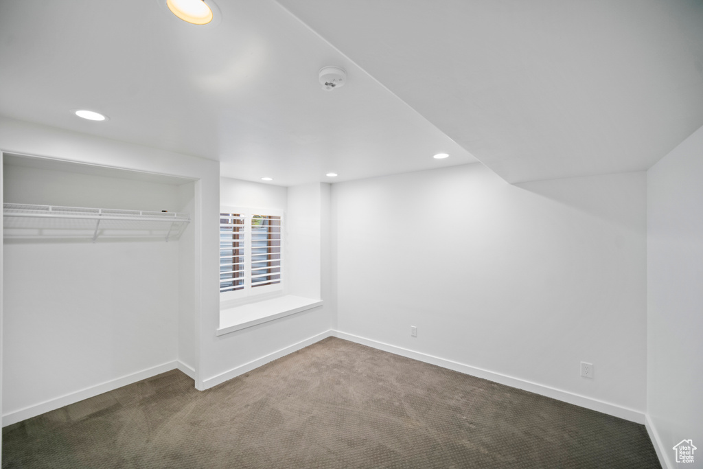 Unfurnished bedroom with carpet, baseboards, recessed lighting, and a closet
