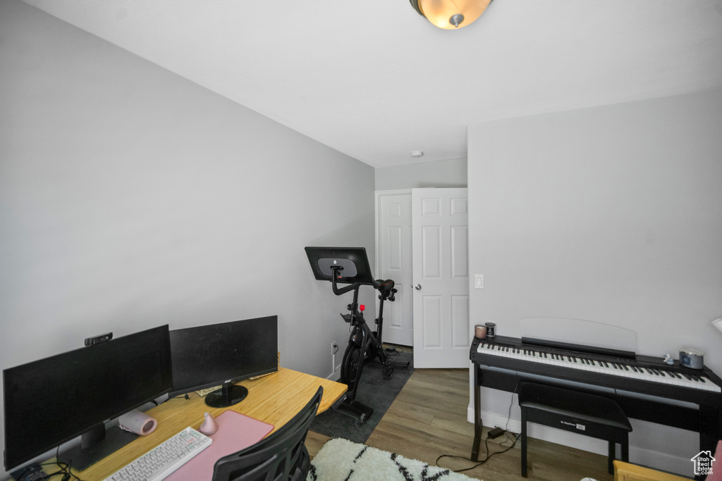 Home office with wood finished floors