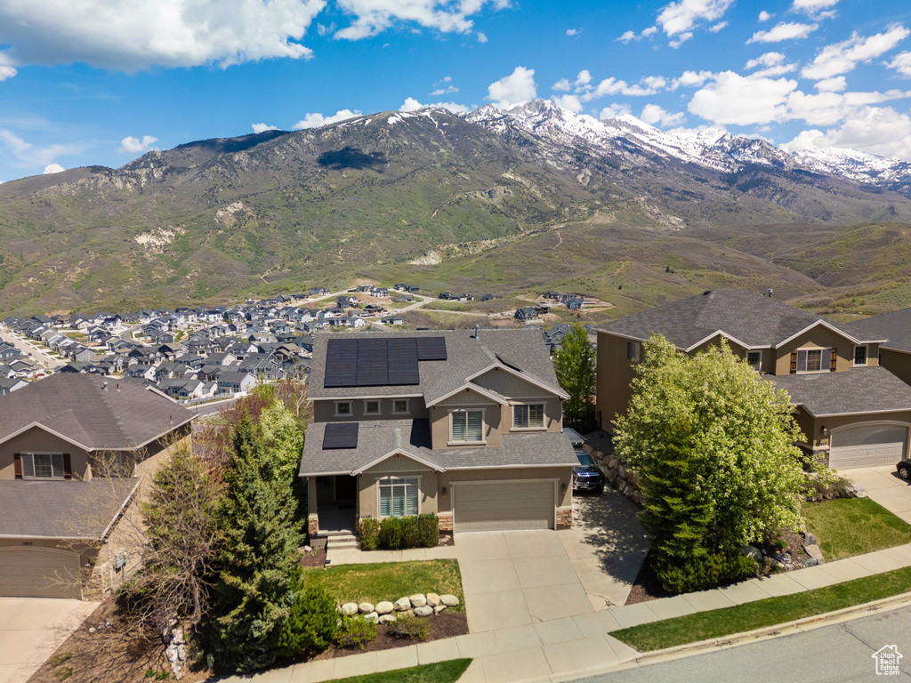 View of mountain backdrop featuring nearby suburban area