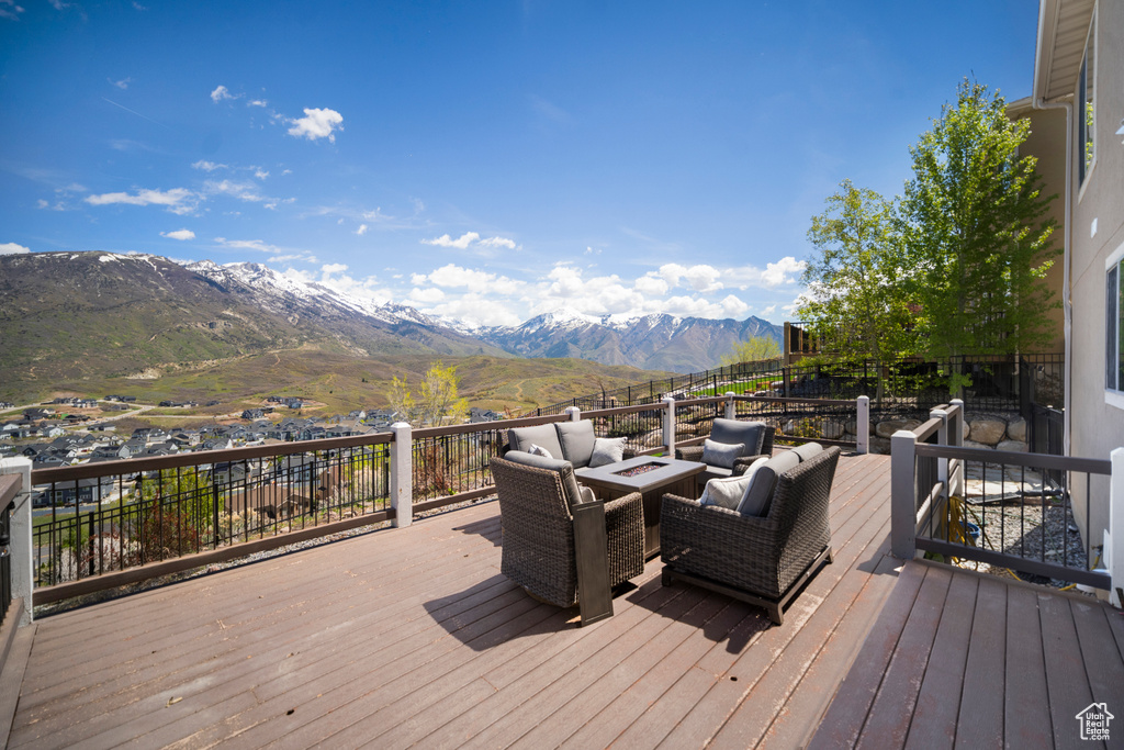 Wooden terrace with a mountain view and an outdoor living space