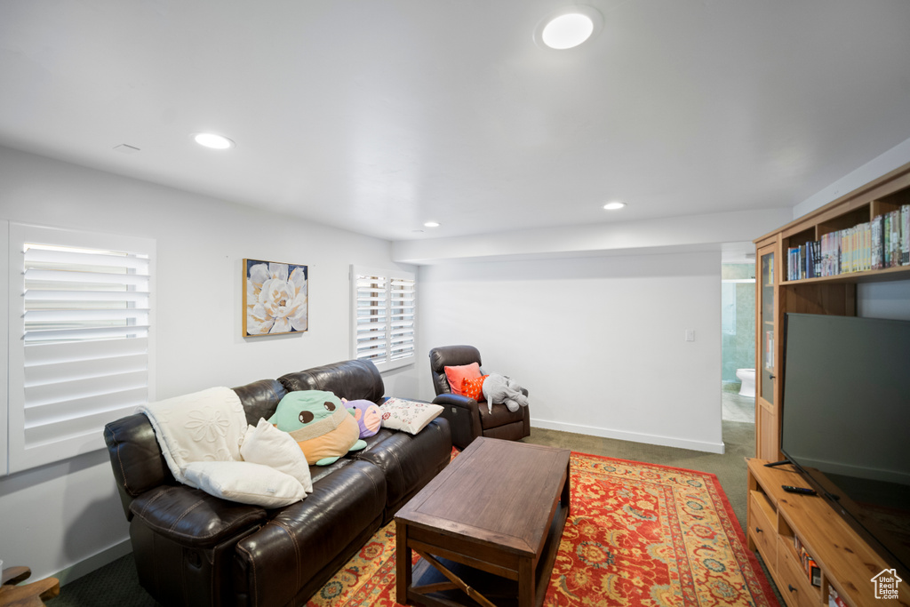 Living room with plenty of natural light, recessed lighting, and baseboards