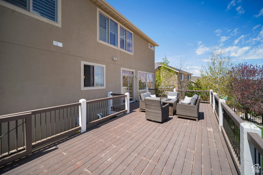 Deck with an outdoor living space