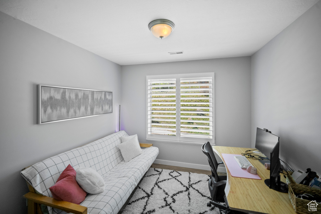 Office area featuring wood finished floors and baseboards