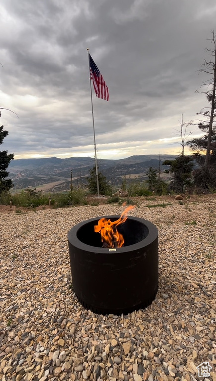 Exterior view of a fire pit and a mountain view