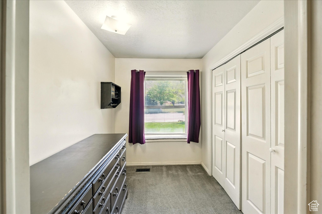Interior space with carpet and baseboards