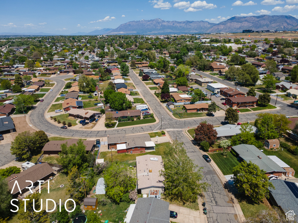 Aerial perspective of suburban area featuring a mountainous background