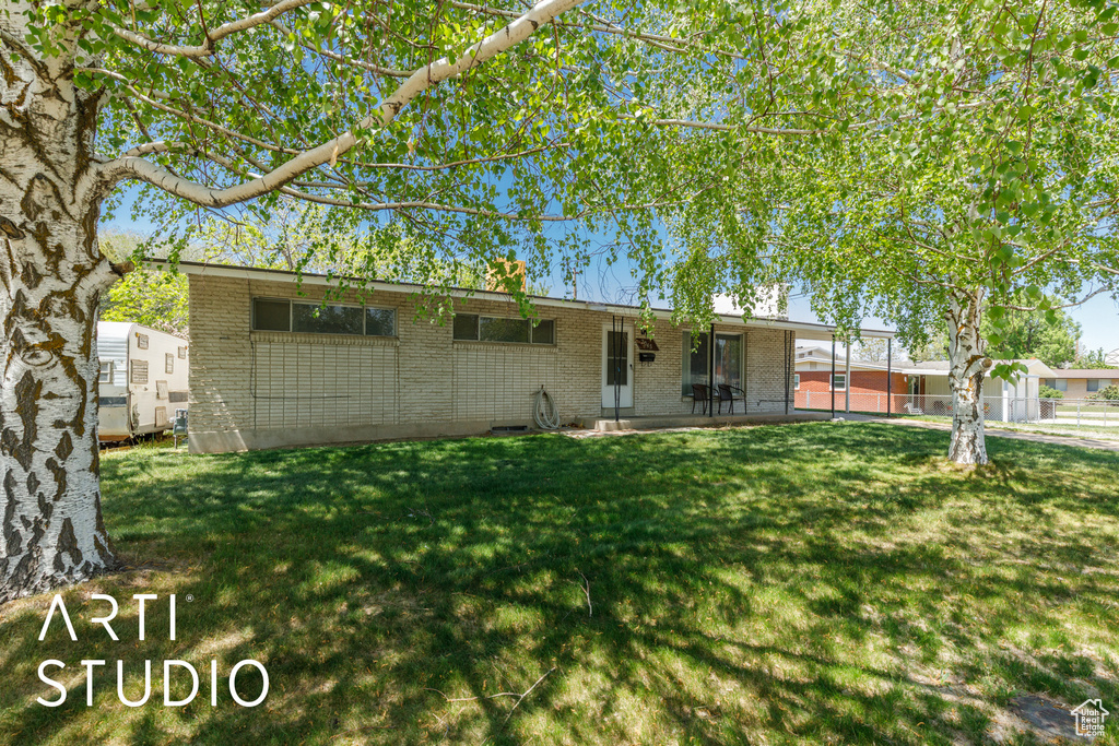Back of house with brick siding and a patio area