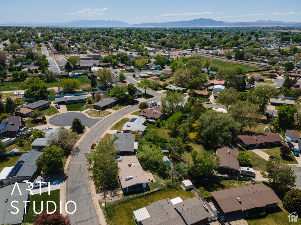 View of property location featuring nearby suburban area and a mountain backdrop