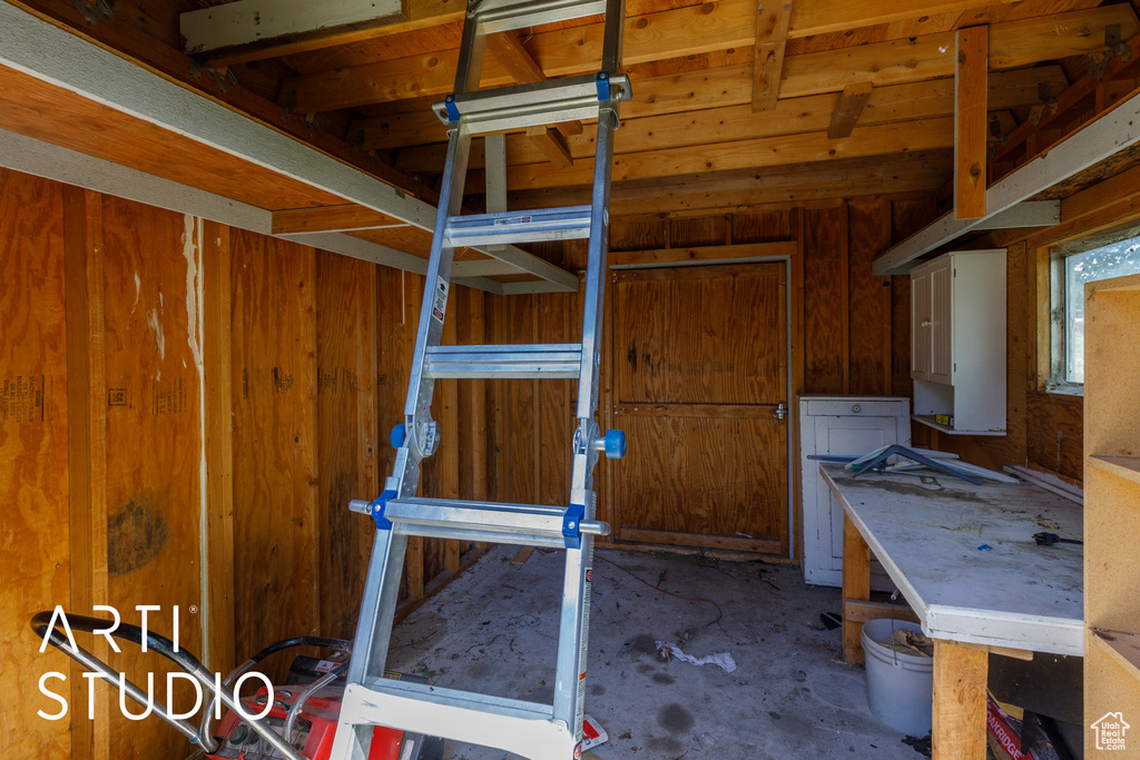 Miscellaneous room with concrete floors and a workshop area