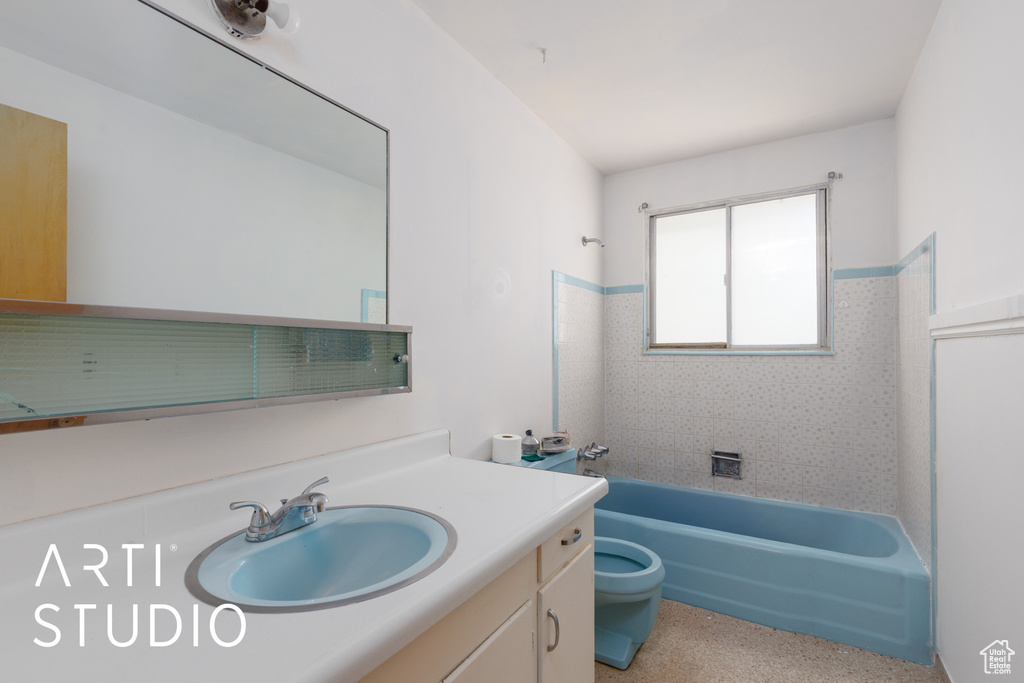 Full bathroom with toilet, vanity, and bathing tub / shower combination