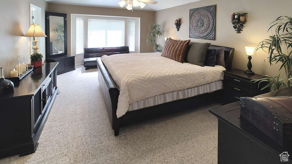 Bedroom with light carpet