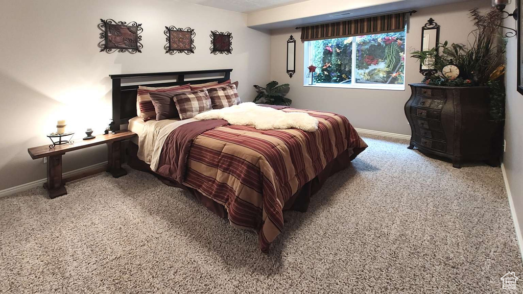 Bedroom with carpet and baseboards