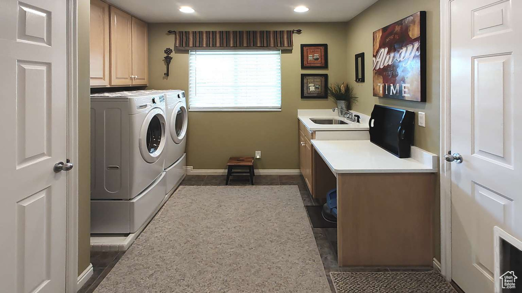 Clothes washing area featuring cabinet space, washer and clothes dryer, recessed lighting, and baseboards
