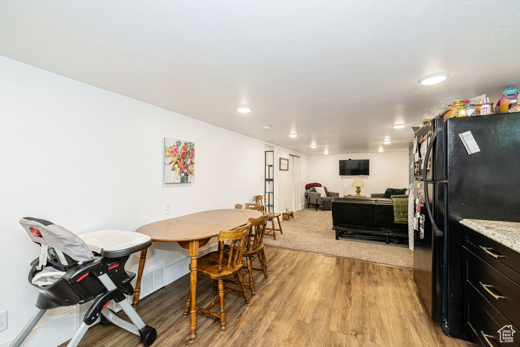 Dining room with light wood finished floors and baseboards