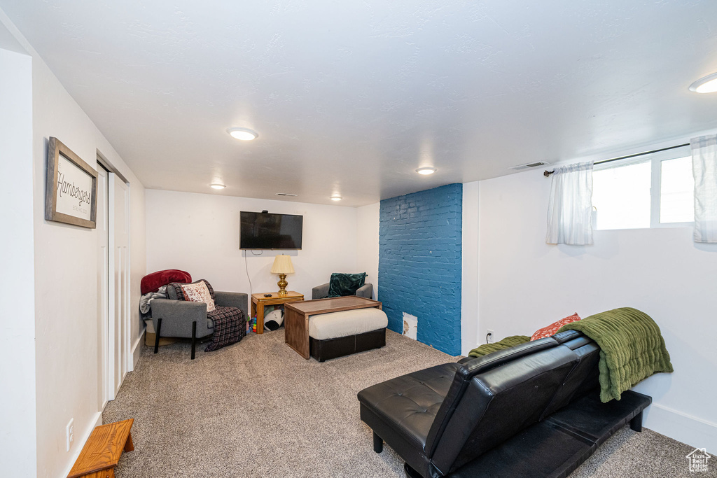 Carpeted living room with recessed lighting