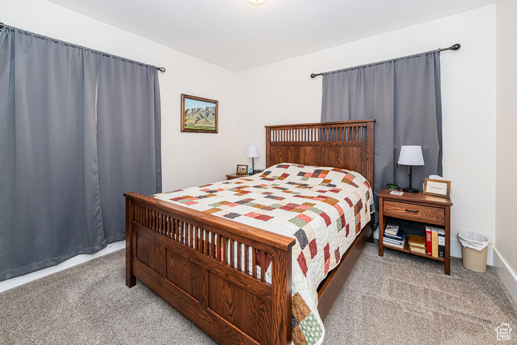 Bedroom with light carpet